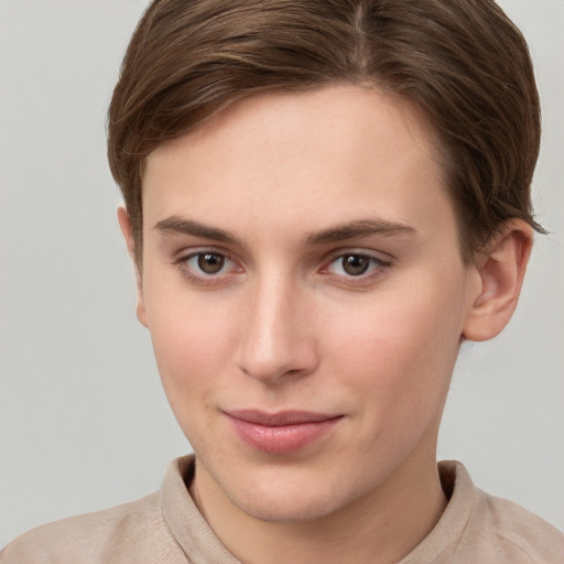 Joyful white young-adult female with short  brown hair and grey eyes