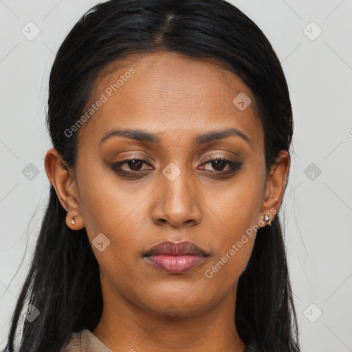 Joyful black young-adult female with long  brown hair and brown eyes