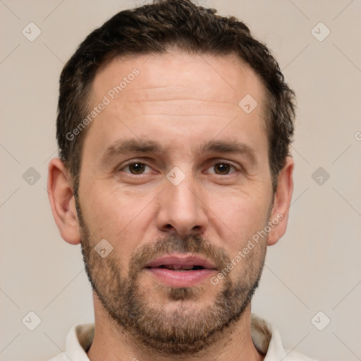 Joyful white adult male with short  brown hair and brown eyes