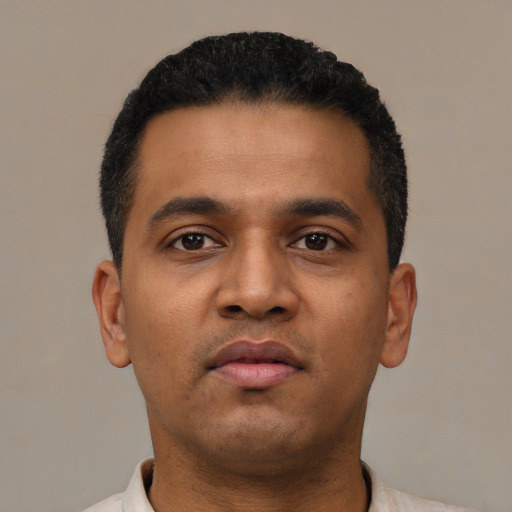 Neutral latino young-adult male with short  black hair and brown eyes