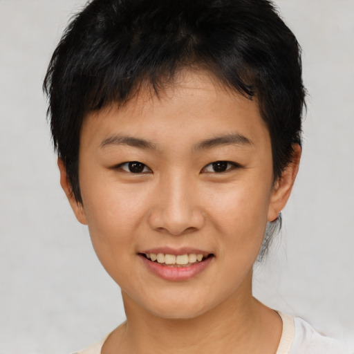 Joyful asian young-adult female with short  brown hair and brown eyes