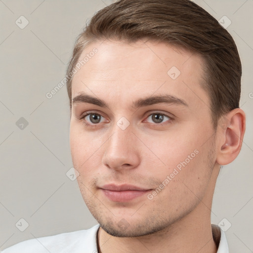 Neutral white young-adult male with short  brown hair and brown eyes