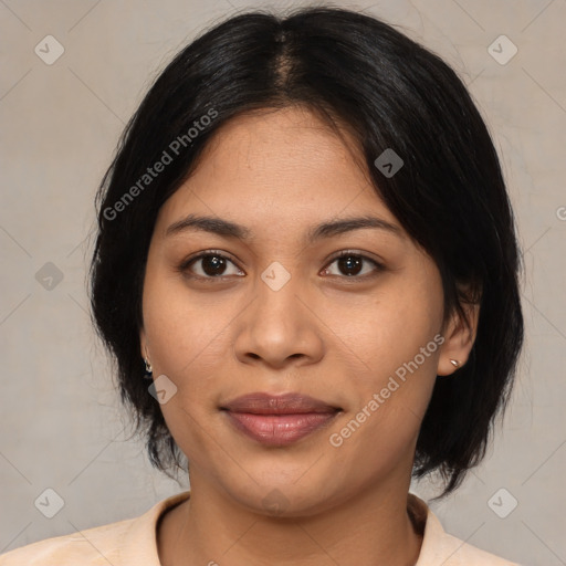 Joyful latino young-adult female with medium  black hair and brown eyes