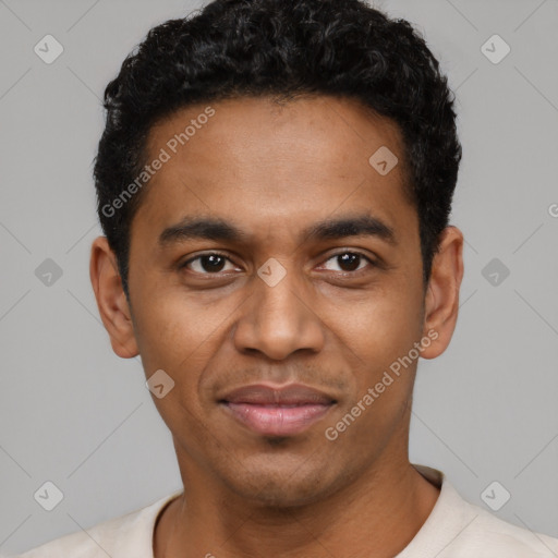 Joyful black young-adult male with short  black hair and brown eyes