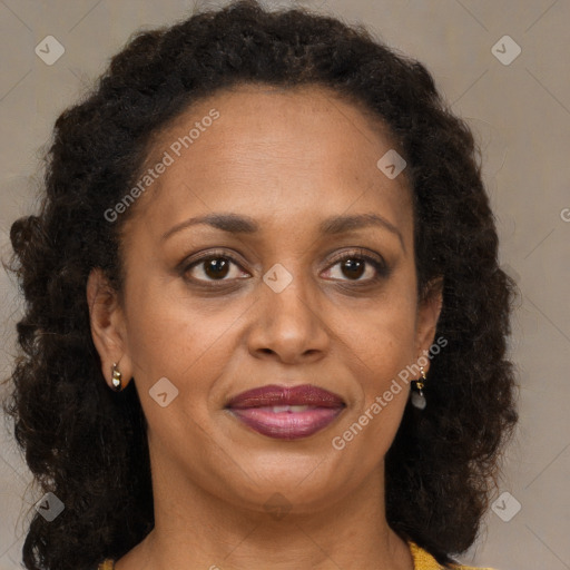 Joyful black adult female with medium  brown hair and brown eyes