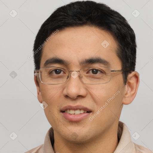 Joyful asian adult male with short  black hair and brown eyes