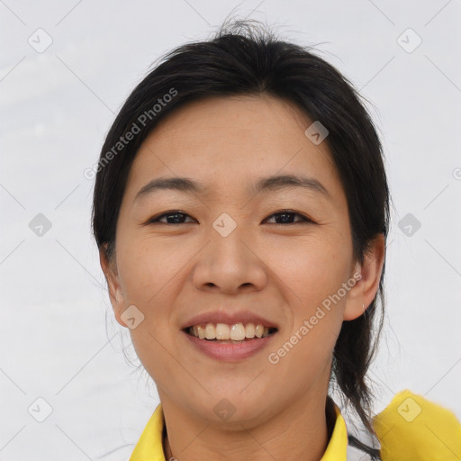 Joyful asian young-adult female with medium  brown hair and brown eyes