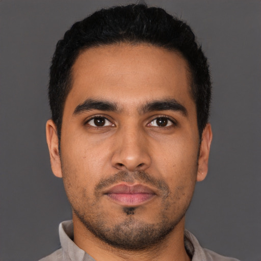 Neutral latino young-adult male with short  black hair and brown eyes