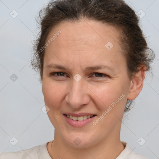 Joyful white adult female with short  brown hair and brown eyes