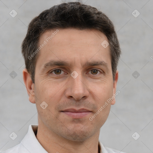 Joyful white adult male with short  brown hair and brown eyes