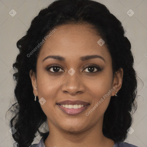 Joyful black young-adult female with long  black hair and brown eyes