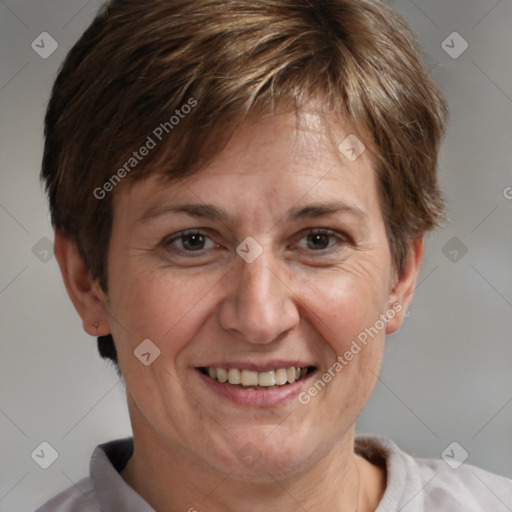 Joyful white adult female with short  brown hair and brown eyes