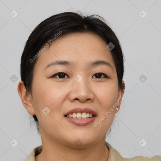 Joyful asian young-adult female with short  brown hair and brown eyes