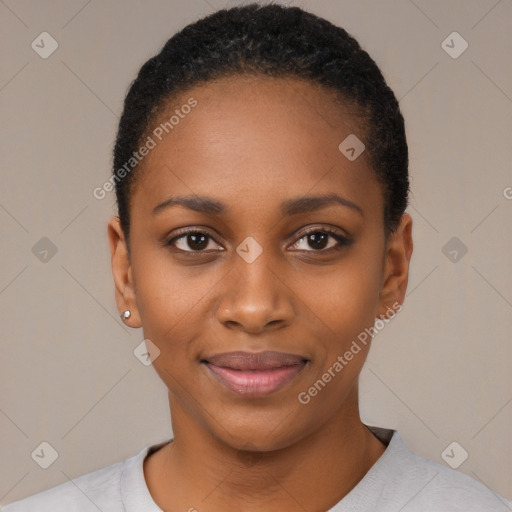 Joyful black young-adult female with short  black hair and brown eyes