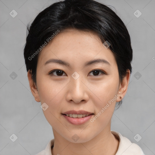 Joyful asian young-adult female with short  brown hair and brown eyes