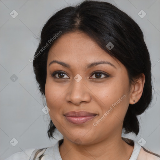 Joyful latino young-adult female with medium  brown hair and brown eyes