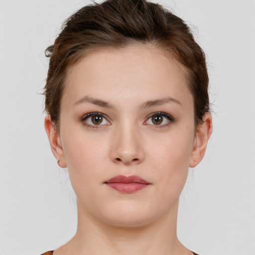 Neutral white young-adult female with short  brown hair and brown eyes