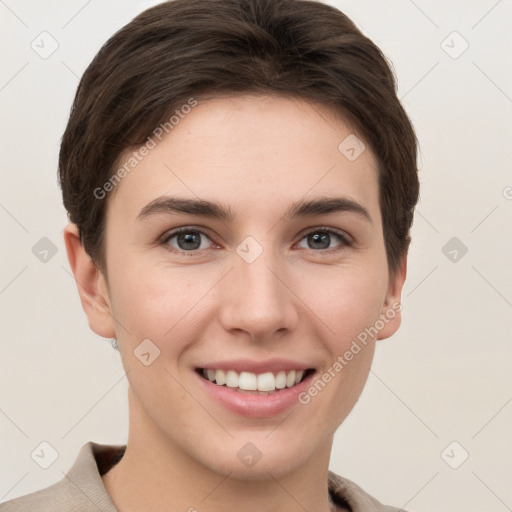 Joyful white young-adult female with short  brown hair and grey eyes