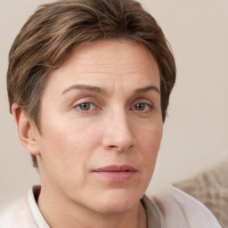 Neutral white adult female with short  brown hair and grey eyes