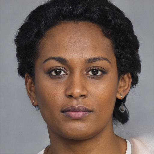 Neutral black young-adult female with short  black hair and brown eyes