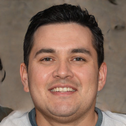 Joyful white young-adult male with short  black hair and brown eyes