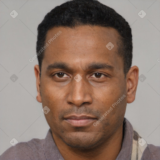 Neutral latino adult male with short  black hair and brown eyes