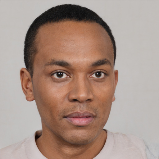 Neutral black young-adult male with short  black hair and brown eyes