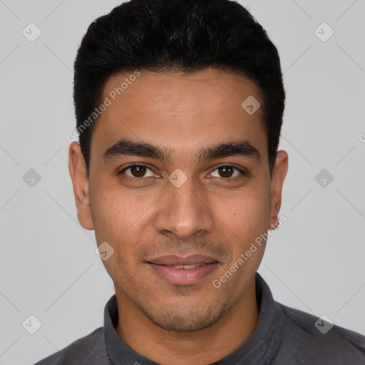 Joyful latino young-adult male with short  black hair and brown eyes