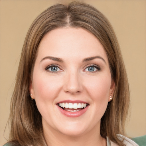 Joyful white young-adult female with medium  brown hair and grey eyes