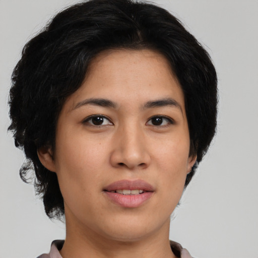 Joyful asian young-adult female with medium  black hair and brown eyes