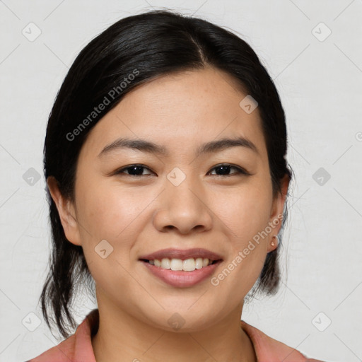 Joyful asian young-adult female with medium  black hair and brown eyes