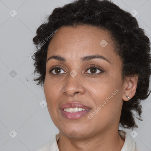 Joyful black young-adult female with medium  brown hair and brown eyes