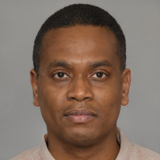 Neutral black young-adult male with short  brown hair and brown eyes