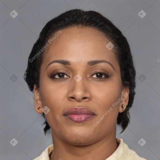 Joyful latino adult female with medium  brown hair and brown eyes