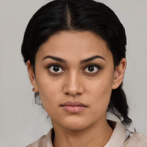 Neutral latino young-adult female with medium  black hair and brown eyes