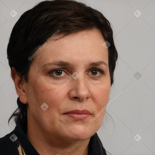 Joyful white adult female with medium  brown hair and brown eyes