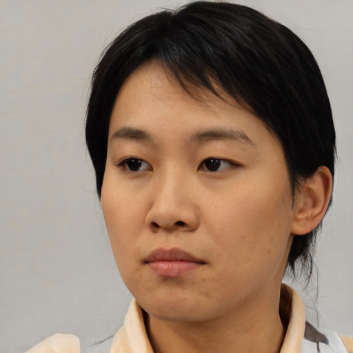 Neutral asian young-adult female with medium  brown hair and brown eyes