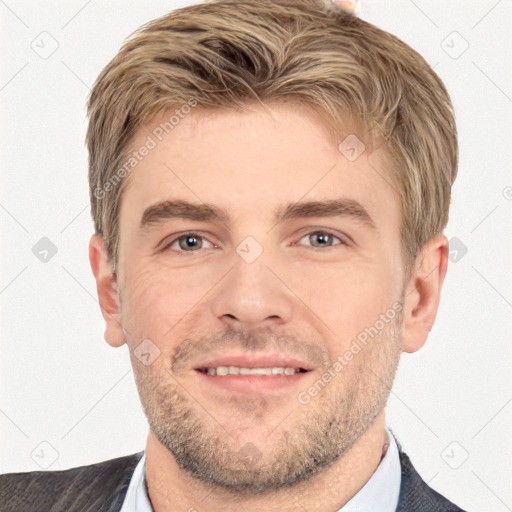 Joyful white young-adult male with short  brown hair and grey eyes