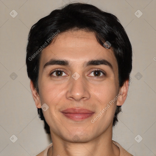 Joyful white young-adult male with short  black hair and brown eyes