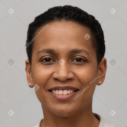 Joyful black young-adult female with short  black hair and brown eyes