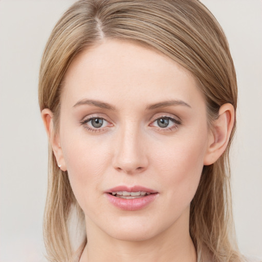 Joyful white young-adult female with long  brown hair and blue eyes