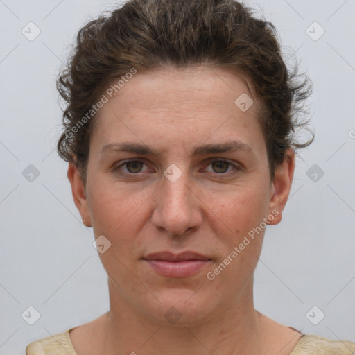 Joyful white adult female with short  brown hair and grey eyes