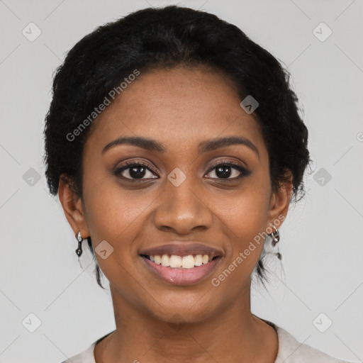 Joyful black young-adult female with short  black hair and brown eyes