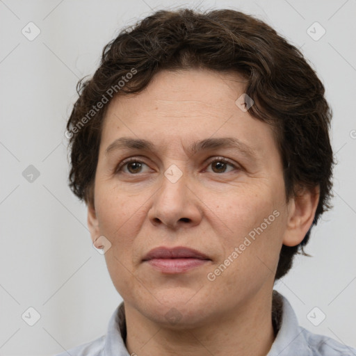 Joyful white adult female with short  brown hair and brown eyes