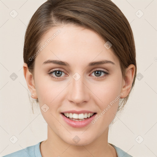 Joyful white young-adult female with medium  brown hair and green eyes