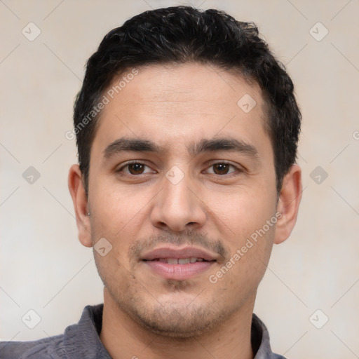 Joyful white young-adult male with short  black hair and brown eyes