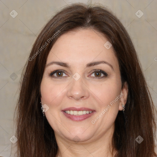 Joyful white adult female with long  brown hair and brown eyes