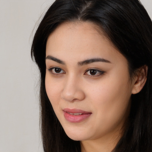 Neutral asian young-adult female with long  brown hair and brown eyes