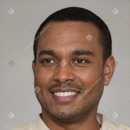 Joyful latino young-adult male with short  black hair and brown eyes