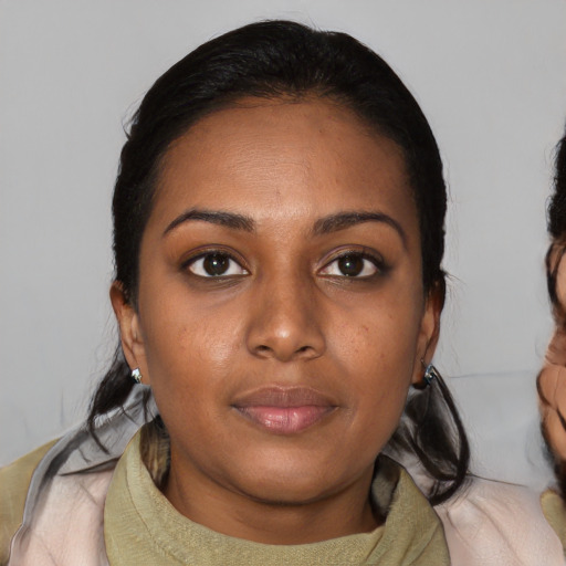Neutral black young-adult female with medium  black hair and brown eyes
